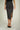 Magasinez la jupe portefeuille brillante de Colori - Shop the shiny wrap skirt from Colori
