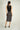 Magasinez la jupe portefeuille brillante de Colori - Shop the shiny wrap skirt from Colori