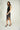 Magasinez la jupe portefeuille brillante de Colori - Shop the shiny wrap skirt from Colori