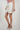 Magasinez la jupe courte portefeuille de Colori - Shop the short wrap skirt from Colori