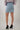 Magasinez la jupe courte à coupe droite de Colori - Shop the straight-cut mini skirt from Colori