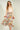 Magasinez la jupe midi fleurie à volants de Colori - Shop the floral ruffle midi skirt from Colori