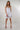 Magasinez la robe courte à volants de Colori - Shop the short ruffled dress from Colori