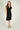 Magasinez la robe portefeuille à manches courtes de Colori - Shop the short sleeve wrap dress from Colori