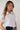 Magasinez la blouse courte à manches courtes de Colori - Shop the crop short sleeve blouse from Colori