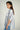 Magasinez la blouse ample à rayures de Colori - Shop the oversized striped blouse from Colori