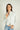 Magasinez la blouse courte à manches longues de Colori - Shop the short blouse with long sleeves from Colori