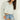 Magasinez la blouse courte à manches longues de Colori - Shop the short blouse with long sleeves from Colori