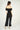 Magasinez la combinaison à épaules dénudées de Colori - Shop the off-the-shoulder jumpsuit from Colori