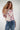 Magasinez le haut en filet fleuri à manches trois-quarts de Colori - Shop the floral mesh top with three-quarter sleeves from Colori
