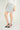Magasinez la jupe courte à texture bouclée de Colori - Shop the short skirt with bouclé texture from Colori