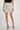 Magasinez la jupe courte portefeuille de Colori - Shop the short wrap skirt from Colori
