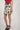 Magasinez la jupe courte imprimée de Colori - Shop the short printed skirt from Colori