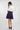 Magasinez la jupe courte plissée de Colori - Shop the mini pleated skirt from Colori