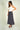 Magasinez la jupe midi en satin de Colori - Shop the satin midi skirt from Colori