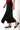 Magasinez la jupe midi asymétrique de Colori - Shop the symmetrical midi skirt from Colori