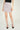 Magasinez la jupe courte à texture bouclée de Colori - Shop the short skirt with bouclé texture from Colori