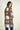 Magasinez le manteau à carreaux en tissu bouclé de Colori - Shop the plaid bouclé coat from Colori