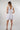 Magasinez la robe courte à volants de Colori - Shop the short ruffled dress from Colori