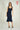 Magasinez la robe midi brillante de Colori - Shop the shiny midi dress from Colori