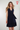 Magasinez la robe cache-coeur unie de Colori - Shop the solid-colored wrap dress from Colori