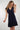 Magasinez la robe cache-coeur unie de Colori - Shop the solid-colored wrap dress from Colori