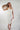 Magasinez la robe portefeuille midi de Colori - Shop the wrap midi dress from Colori