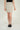 Magasinez la jupe courte à texture bouclée de Colori - Shop the short skirt with bouclé texture from Colori
