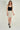 Magasinez la jupe courte à texture bouclée de Colori - Shop the short skirt with bouclé texture from Colori