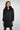Magasinez le long manteau noir bouffant de chez Colori - Shop the long black puffer jacket from Colori