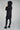 Magasinez le long manteau noir bouffant de chez Colori - Shop the long black puffer jacket from Colori