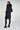Magasinez le long manteau noir bouffant de chez Colori - Shop the long black puffer jacket from Colori
