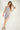 Magasinez la robe courte à texture bouclée de Colori - Shop the short dress with bouclé texture from Colori